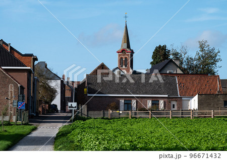 Asse ter Heide, Flemish Brabant - Village and agriculture fields over blue sky Asse ter Heide, Flemish Brabant - Village and agriculture fields over blue sky 96671432
