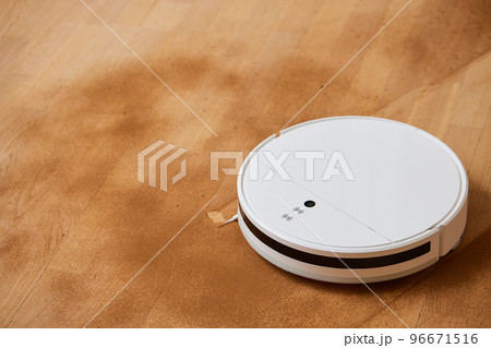 Robot vacuum cleaner cleans the very dirty dusty floor of the apartment at a certain time. 96671516