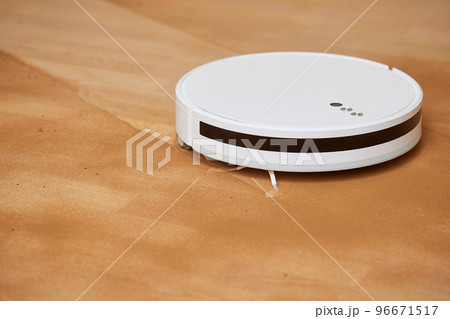 Robot vacuum cleaner cleans the very dirty dusty floor of the apartment at a certain time. Robot vacuum cleaner cleans the very dirty dusty floor of the apartment at a certain time. 96671517