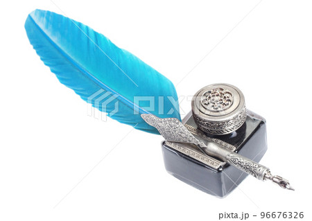 Old blue feather fountain pen with inkwell on white background 96676326