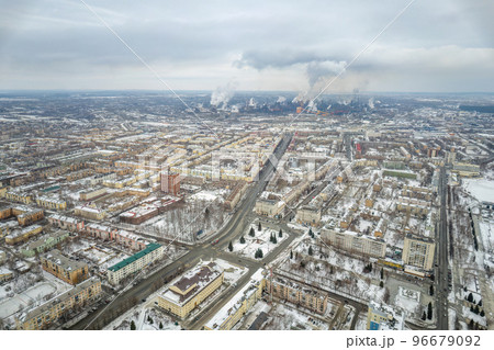 Winter view of the center of the city of Nizhny Tagil and the metallurgical plant from above. Environmental problem of environmental pollution and air in large cities 96679092