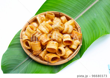 Crispy banana chip rolls. Fruit snack Crispy banana chip rolls. Fruit snack 96680373