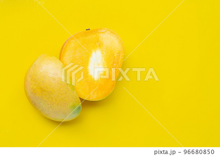 Tropical fruit, Mango on yellow background. Top view 96680850