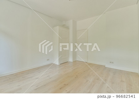 Interior of empty white room with panoramic windows with curtains and wooden parquet floor Interior of empty white room with panoramic windows with curtains and wooden parquet floor 96682541