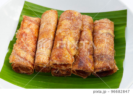 Sun dried banana roll snacks 96682847