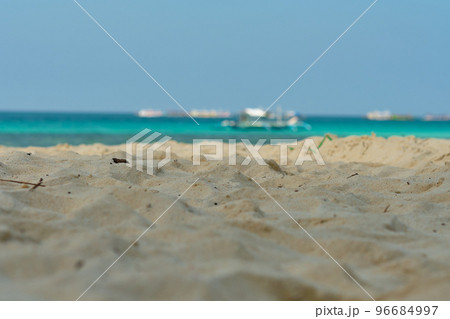 Boracay, Philippines - Jan 30, 2020: Empty White beach of Boracay island in the daytime. No Chinese tourists because of the coronavirus. Boats in the sea carry tourists. Boracay, Philippines - Jan 30, 2020: Empty White beach of Boracay island in the daytime. No Chinese tourists because of the coronavirus. Boats in the sea carry tourists. 96684997