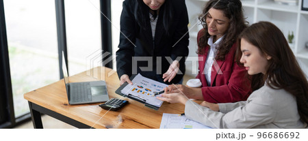 business adviser meeting to analyze and discuss the situation on the financial report in the meeting room.Investment Consultant, Financial advisor and accounting concept 96686692