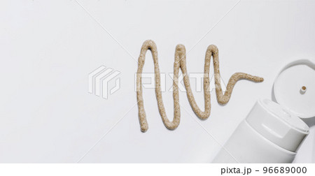 Creamy natural scrub on white Isolated background. Mock up. Liquid cosmetic, poured texture from a tube 96689000