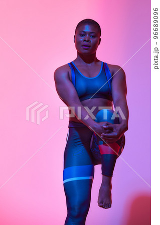 Body Positivity And Sport. Smiling Curvy Black Woman In Sportswear Free Copy Space For Advertisement, Standing Isolated On Neon Pink Studio Background, Banner 96689096