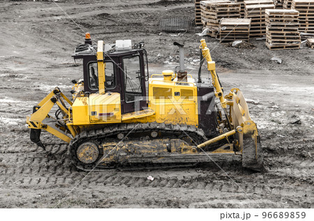 Tractor excavator digging the ground Tractor excavator digging the ground 96689859