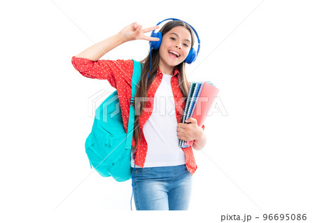School girl, teenage student in headphones hold books on white isolated studio background. School and music education concept. School girl, teenage student in headphones hold books on white isolated studio background. School and music education concept. 96695086