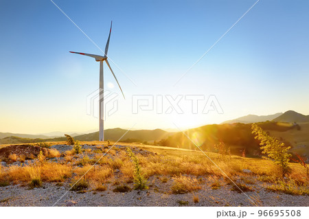 View of power stations for renewable electric energy production. Windmill on sunny summer day. High wind turbine for generation electricity. View of power stations for renewable electric energy production. Windmill on sunny summer day. High wind turbine for generation electricity. 96695508