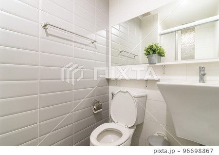 Loft white tile bathroom corner, tub and sink Loft white tile bathroom corner, tub and sink 96698867
