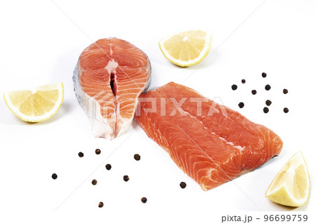 Salmon, fillet and slice of fresh raw fish with lemon slices and black pepper, isolated on white background 96699759