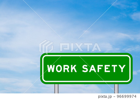 Green color transportation sign with word work safety on blue sky with white cloud background 96699974