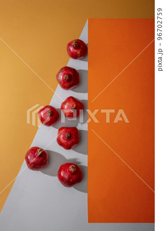 Geometric still life with seven ripe pomegranates 96702759
