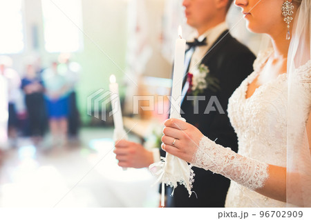 Married couple posing in a church after ceremony Married couple posing in a church after ceremony 96702909