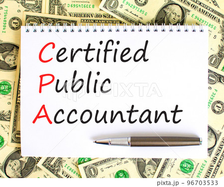 CPA certified public accountant symbol. Concept words CPA certified public accountant on white note on background from dollar bills. Business and CPA certified public accountant concept. Copy space. 96703533