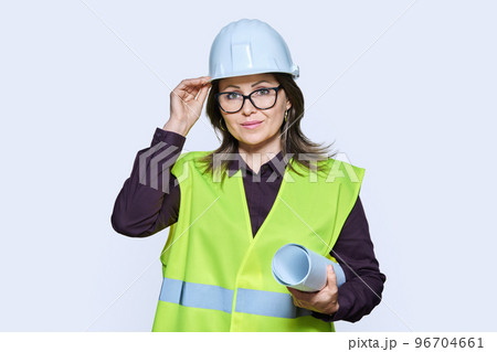 Woman engineer architect in helmet protective vest on white background 96704661