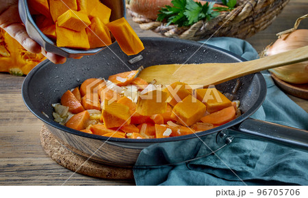 fresh sliced pumpkin on frying pan fresh sliced pumpkin on frying pan 96705706