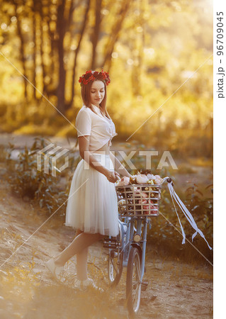 Woman with vintage bike Woman with vintage bike 96709045
