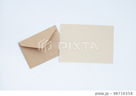 Brown paper and envelopes on white background. 96710358