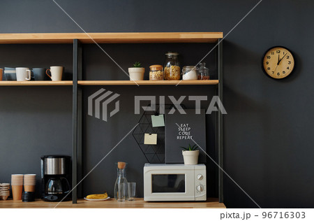 Modern office kitchen for lunch and coffee break with kitchen utensils and modern appliance 96716303