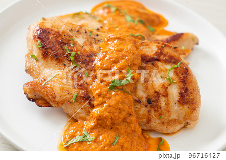 grilled chicken steak with red curry sauce grilled chicken steak with red curry sauce 96716427