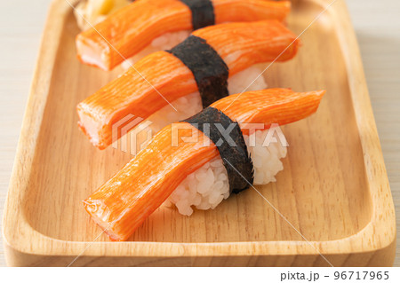 Crab Stick Sushi on wood plate 96717965
