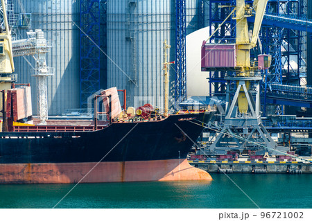 industrial infrastructure of seaport, sea, cranes and dry cargo ship, grain silo, bulk carrier vessel and grain storage elevators, concept of sea cargo transportation industrial infrastructure of seaport, sea, cranes and dry cargo ship, grain silo, bulk carrier vessel and grain storage elevators, concept of sea cargo transportation 96721002