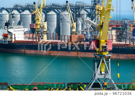 industrial seaport infrastructure, sea, cranes and dry cargo ship, grain silo, bulk carrier vessel and grain storage elevators, concept of sea cargo transportation industrial seaport infrastructure, sea, cranes and dry cargo ship, grain silo, bulk carrier vessel and grain storage elevators, concept of sea cargo transportation 96721036