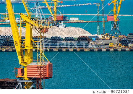 industrial seaport infrastructure - sea, cranes and minerals, metal and bundles of wire, concept of maritime cargo transportation industrial seaport infrastructure - sea, cranes and minerals, metal and bundles of wire, concept of maritime cargo transportation 96721084