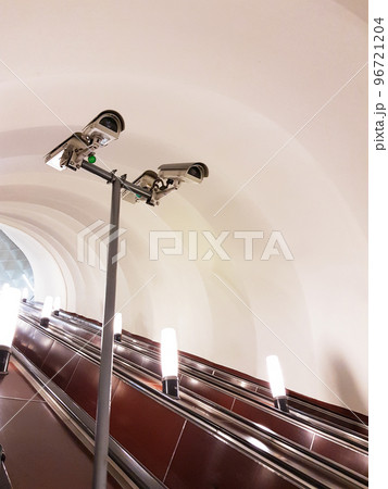 Four cameras underground on the subway station on escalator. Security concept 96721204