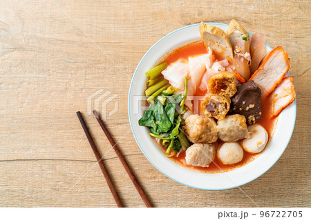 noodles with meatballs in pink soup 96722705