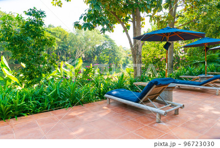 umbrella and pool bed around swimming pool umbrella and pool bed around swimming pool 96723030
