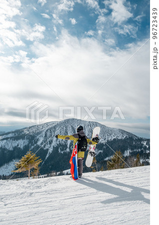 man snowboarder with slovakia flag at ski resort slope man snowboarder with slovakia flag at ski resort slope 96723439