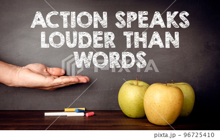 Action Speaks Louder Than Words Concept. Teacher's desk Action Speaks Louder Than Words Concept. Teacher's desk 96725410