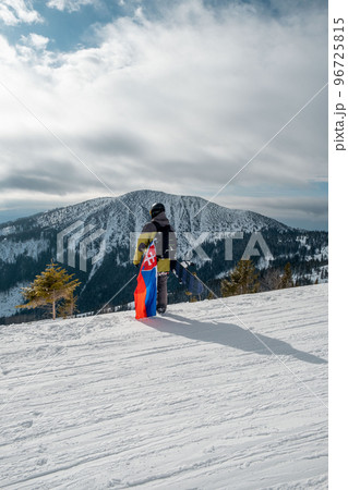 man snowboarder with slovakia flag at ski resort slope man snowboarder with slovakia flag at ski resort slope 96725815