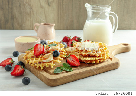 Concept of tasty food with wafers with fruits, berries and caramel Concept of tasty food with wafers with fruits, berries and caramel 96726081