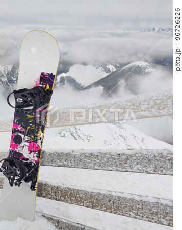 snowboard stick in snow mountains on background 96726226