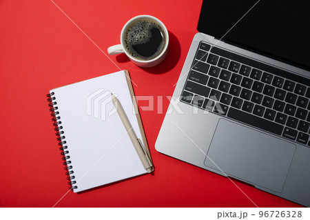 Workplace with laptop, blank notebook and accessories, top view Workplace with laptop, blank notebook and accessories, top view 96726328