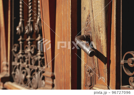 Old wooden doors in Lviv city in sunny day Old wooden doors in Lviv city in sunny day 96727096