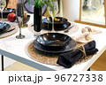 Table setting with black dishes for a festive romantic dinner or homemade dinner 96727338