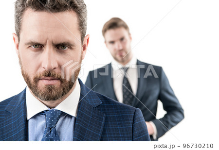 Portrait of professional business man and blur employee in background isolated on white, serious 96730210