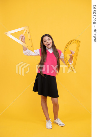 geometric shapes. measure the angle. child with triangle. amazed teen girl hold protractor ruler. geometric shapes. measure the angle. child with triangle. amazed teen girl hold protractor ruler. 96730891