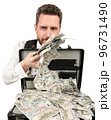 rich millionaire holding case full of dollar cash isolated on white background, bribe 96731490