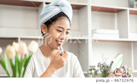 Half Japanese woman putting on makeup and hair to prepare for work in the morning, Facial care and cosmetics, Make up mirror,  Take a shower and put on make-up and get dressed and ready to go to work 96732976