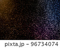 Dust particles floating on a colorful rainbow light on black background. Glittering sparkling flickering overlay. 96734074