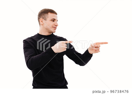 a man in black clothes points his finger at something on a white background. 96738476