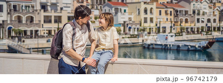 BANNER, LONG FORMAT Father and son tourists enjoying the views of Architecture and luxury yachts in Lustica Bay, Montenegro. Travel around Montenegro concept. Go Everywhere BANNER, LONG FORMAT Father and son tourists enjoying the views of Architecture and luxury yachts in Lustica Bay, Montenegro. Travel around Montenegro concept. Go Everywhere 96742179